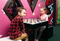 Little kids playing chess in entertainment center Royalty Free Stock Photo