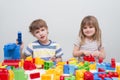 Little kids playing with lots of colorful plastic blocks Royalty Free Stock Photo