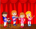 Little kids playing music in a music band Royalty Free Stock Photo