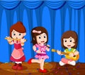 Little kids playing music in a music band Royalty Free Stock Photo