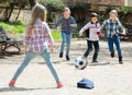 Little kids playing street football outdoors Royalty Free Stock Photo