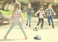 Little kids playing street football outdoors Royalty Free Stock Photo