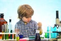 Little kids scientist earning chemistry in school lab. What is taught in chemistry. Lab microscope and testing tubes