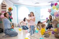 Little kids and parents have fun on children birthday party