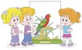 Little kids watching a parrot in a zoo Royalty Free Stock Photo