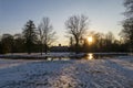 little lake Favorite Foerch Palace with snow at sunset, in winter time Royalty Free Stock Photo