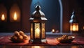 a little lantern in a dark room with candles, with snacks arround. the lantern