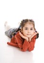 The little laying girl isolated on a white Royalty Free Stock Photo