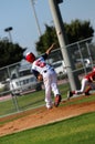 Little league pitcher throwing to first