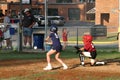 Little League player swings at softball