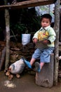 A little Lepcha boy and hen family