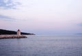 Little lighthouse in the beautiful harbor of a small town Postira Croatia, Brac island. Royalty Free Stock Photo