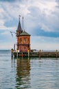 Little lighthouse on pier in harbor of Konstanz, Baden-Wurttemberg, Germany Royalty Free Stock Photo