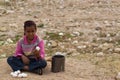 A little local bedouin girl is trying to sell homegrown eggs