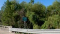 Little Lotts Creek street sign and bridge crossing Royalty Free Stock Photo