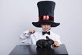 Little magician with rabbit studio shot Royalty Free Stock Photo