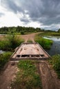 Little makeshift bridge over the river Inya. Western Siberia