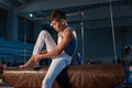 Little male gymnast training in gym, flexible and active Royalty Free Stock Photo