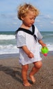 Little mariner on the beach Royalty Free Stock Photo