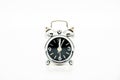 little metal alarm clock on white, twelve hours Royalty Free Stock Photo