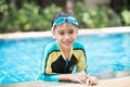 Little mix Asian Arab boy swimming at swimming pool outdoor activity Royalty Free Stock Photo