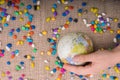 Little model globe amid colorful pebbles Royalty Free Stock Photo