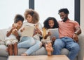 Little moments make big memories. a young family spending time together and using a digital tablet at home. Royalty Free Stock Photo