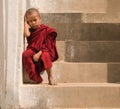 Little monk stay in pagoda Mandalay,Myanmar. Little monk or novice monk sitting in pagoda mandalay myanmar.