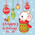 The little mouse is sitting in a Christmas mitten