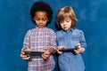 Little multiracial children boys using smartphone application Royalty Free Stock Photo