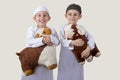 Little Muslim kids playing with sheep toys