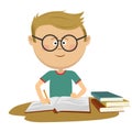 Little nerd boy with glasses doing his homework Royalty Free Stock Photo