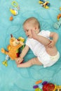 A little newborn baby boy is lying on a blue blanket Royalty Free Stock Photo