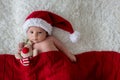 Little newborn baby boy, wearing Santa hat Royalty Free Stock Photo