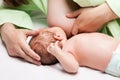 Little newborn baby child sucking or eating mother breast milk Royalty Free Stock Photo