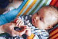 Little newborn baby holding parent& x27;s one hand, close-up macro shot Royalty Free Stock Photo