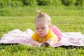 Little newborn girl lying on the grass Royalty Free Stock Photo