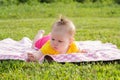 Little newborn girl lying on the grass Royalty Free Stock Photo