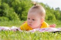 Little newborn girl lying on the grass Royalty Free Stock Photo