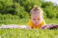 Little newborn girl lying on the grass Royalty Free Stock Photo