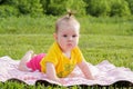 Little newborn girl lying on the grass Royalty Free Stock Photo