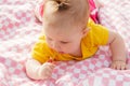 Little newborn girl lying on the grass Royalty Free Stock Photo