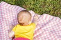 Little newborn girl lying on the grass Royalty Free Stock Photo