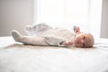 A Little Newborn relaxing on the parent bed Royalty Free Stock Photo