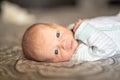 A Little Newborn relaxing on the parent bed Royalty Free Stock Photo