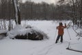 A little nine-year-old boy on skis in the winter dense forest Royalty Free Stock Photo