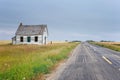 Little old abandoned country school sitting beside a narrow highway Royalty Free Stock Photo