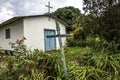 Little old chapel with wooden cross in coutryside