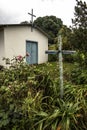 Little old chapel with wooden cross in coutryside