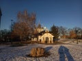Little orthodox church with gold criests on winter evening
